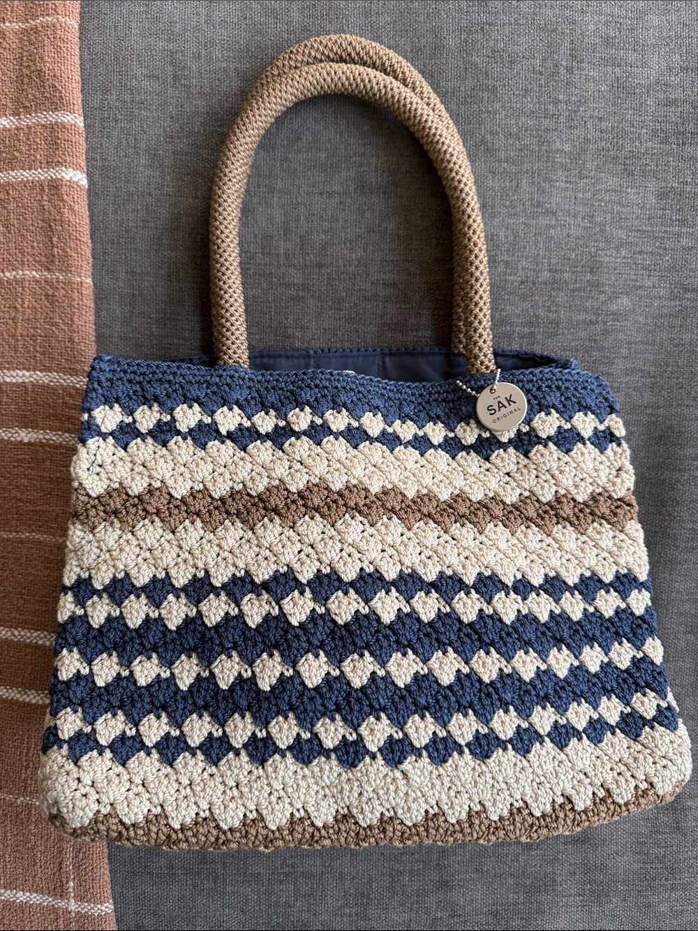 The Sak Crochet Knit Tote in Navy, Cream & Brown with Rope Handles